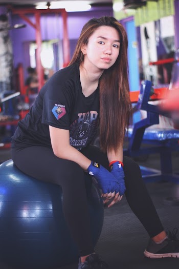 Person Sitting On Blue Stability Ball 