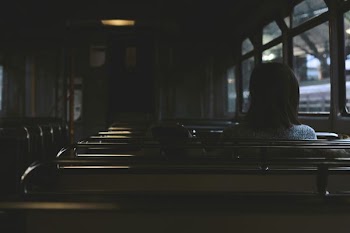person sitting on bus chair