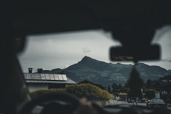 Person Sitting on Car Seat Viewing Mountain