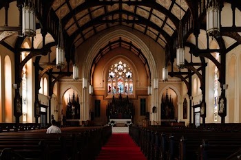 person sitting on chair inside church