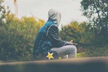 person sitting on floor outdoor