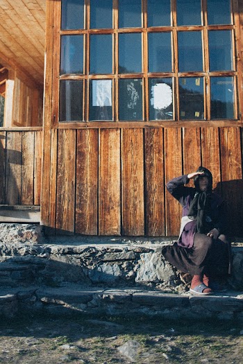 Person Sitting on Front Steps