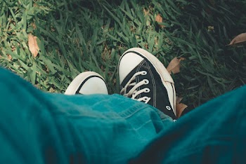 Person Sitting on Grass