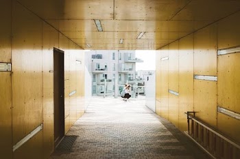 person sitting on gray flooring
