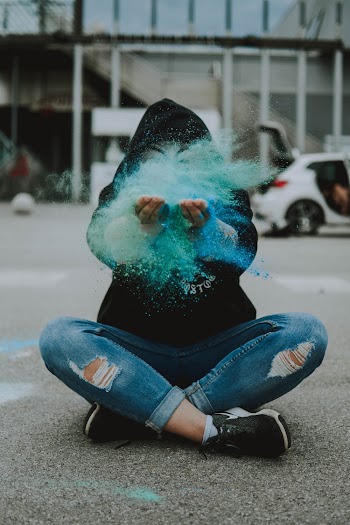 Person Sitting on Ground