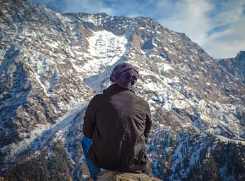 Person Sitting on Hill
