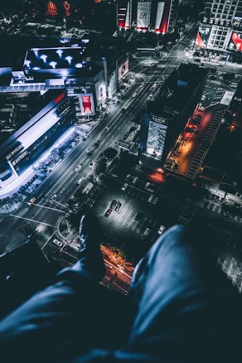 person sitting on top of building