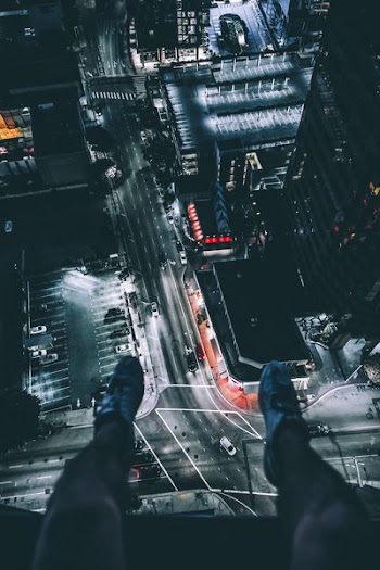 person sitting on top of building