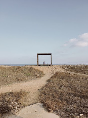 Person Sitting on Wooden Frame