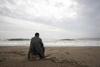 Person Sitting Outdoors