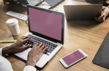 Person Sitting White Using Macbook Pro