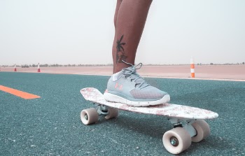 Person Skateboarding on Road