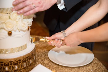 Person Slicing Cake