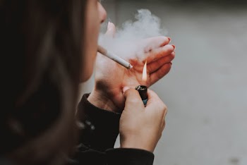 Person Smoking Cigarette