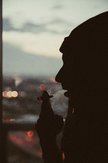 person smoking marijana joint