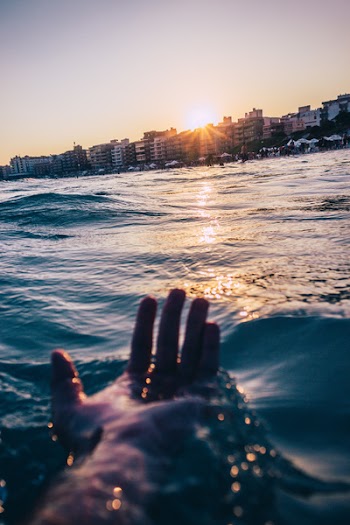 Person Soaking At The Beach