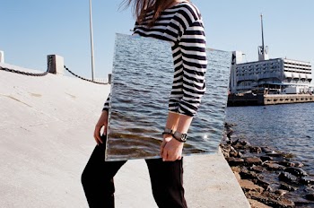 Person Standing and Holding Mirror Near Sea