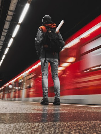 Person Standing at Train Station