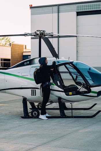 Person Standing Beside Helicopter