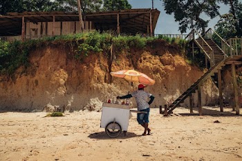Person Standing Beside Push Cart