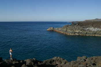Person Standing By The Cliff