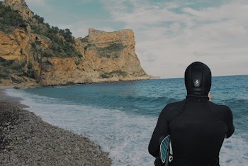 Person Standing By The Ocean