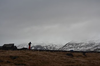 person standing front of mountain
