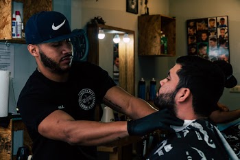 Person Standing Holding Neck of Man Inside Room