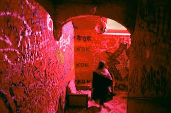 Person Standing in Between Walls