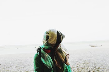 person standing in front of the beach