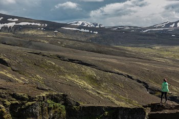 Person Standing in Front of the Mountain