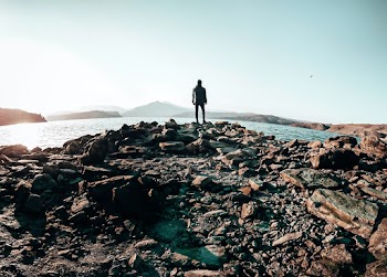 Person Standing in Rocks