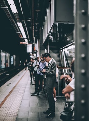 person standing inside a train station