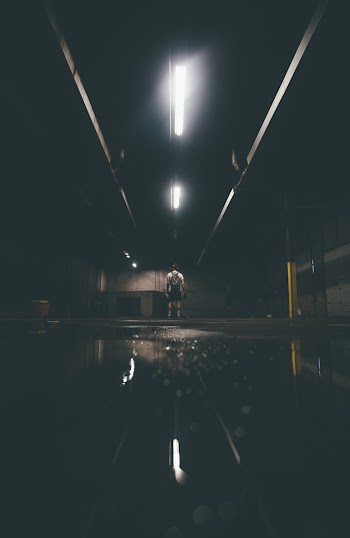 Person Standing Inside Tunnel