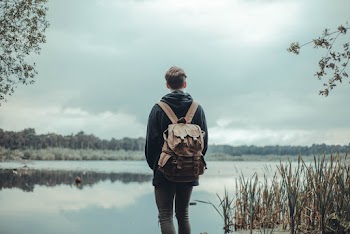 Person Standing Near Body of Water
