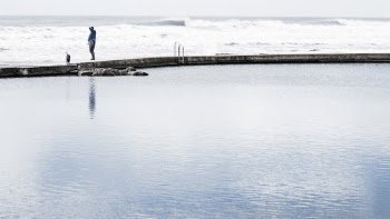 Person Standing Near Body of Water
