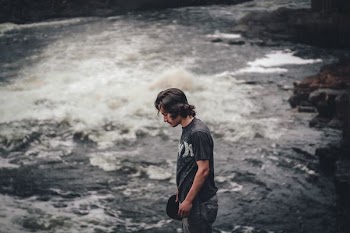 person standing near body of water