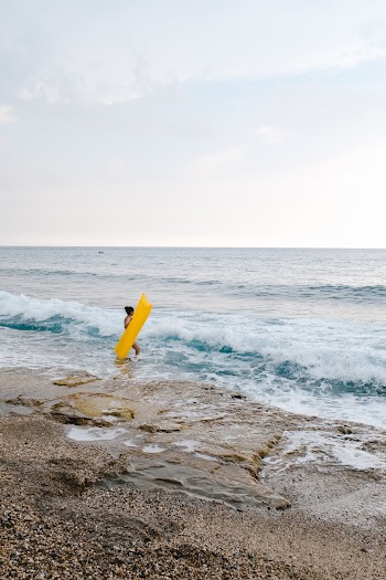 Person Standing Near Body of Water