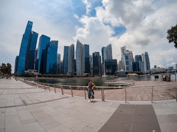 Person Standing Near High-rise Buildings