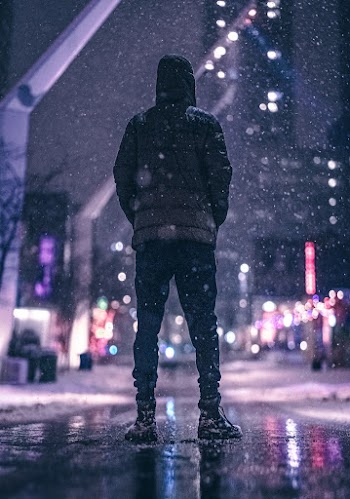 Person Standing Near Road  during Nighttime