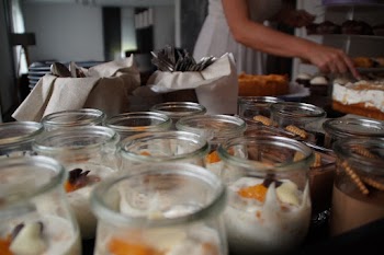 Person Standing Near Table With Dessert on Top