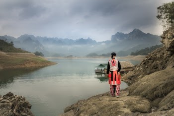 Person Standing Near the Body of Water