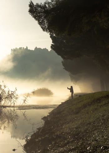 Person Standing Near Water