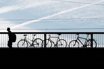 person standing next to bikes