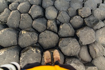 Person Standing on a Rocks  