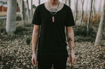 person standing on brown dried leaves
