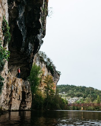 Person Standing on Cave