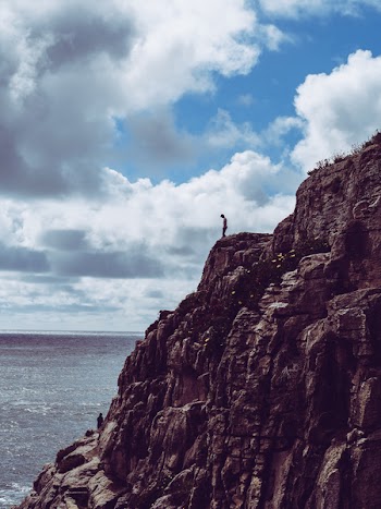 Person Standing On Cliff