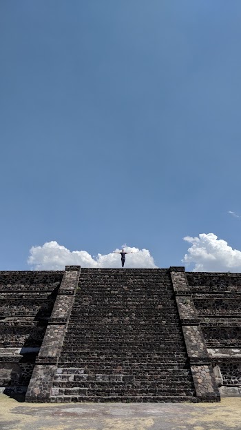 Person Standing on Concrete Structure With Stairs
