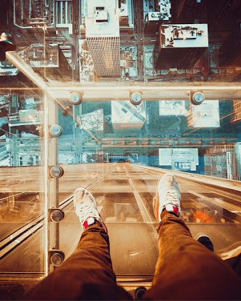 Person Standing On Glass Floor